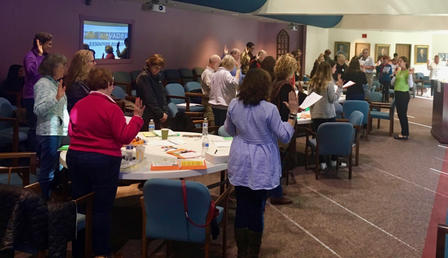 Participants of the Refugee and Immigrant Volunteer Summit recite the Oath of Compassion.