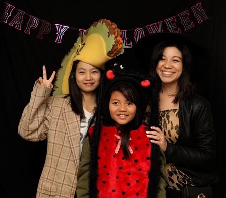 ACP students enjoy the photo booth at the IRC Halloween Party