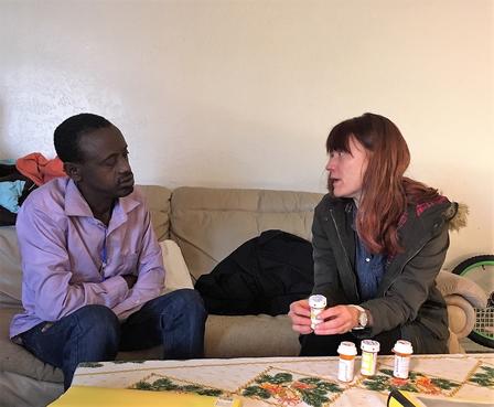 Erica, a health mentor, meets with a newly arrived refugee. Erica, a health mentor with the International Rescue Committee in Salt Lake City, meets with a newly arrived refugee.