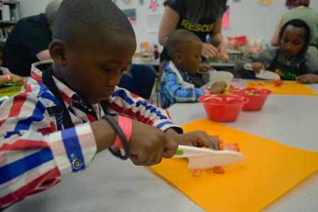 Refugee children participate in workshops at the Refugee Health Fair, an event organized by the International Rescue Committee in Salt Lake City.