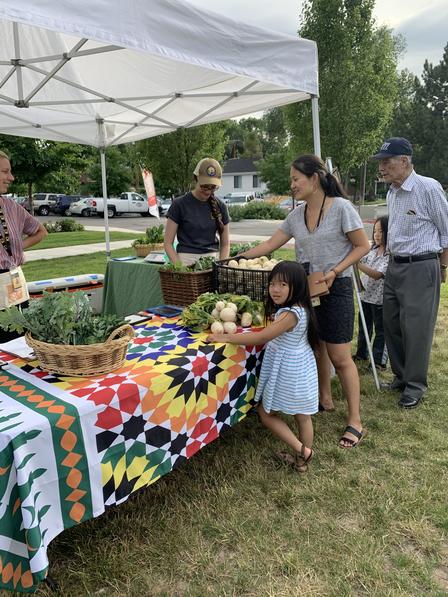 The Central Park Market runs each Tuesday evening from 5-7:30. Customers enjoy freshly grown, culturally appropriate produce grown by New Roots farmers. New Roots is a program of the International Rescue Committee in Salt Lake City.