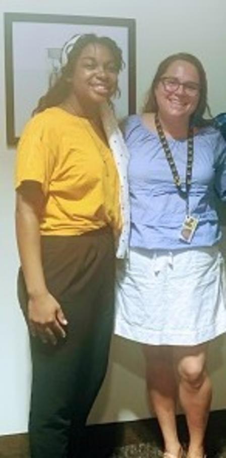 Sheyla (left) next to her employment specialist Mary Ricchezza at the IRC office.