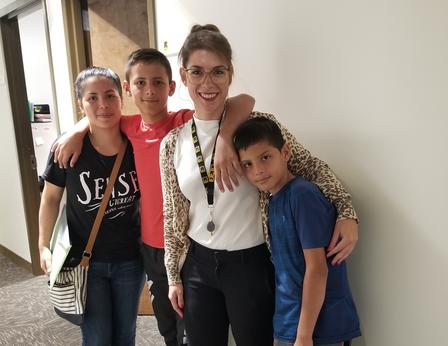 Maria, her two sons, and IRC immigration specialist Alexandra Weidt