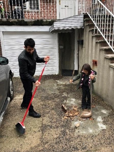 Family outside their home Family in front of their garage