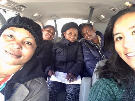 IRC employment specialist Danielle Lew drives four clients to a job interview in the grey mini-van.