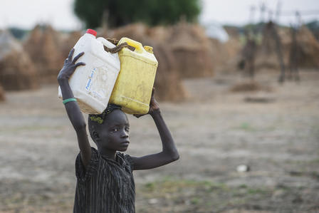 A boy fetches water in a camp in Ganyliel