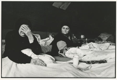 Bosnian refugees in Croatia Two Bosnian women lie in beds in a refugee camp in Croatia, one of whom is crying.