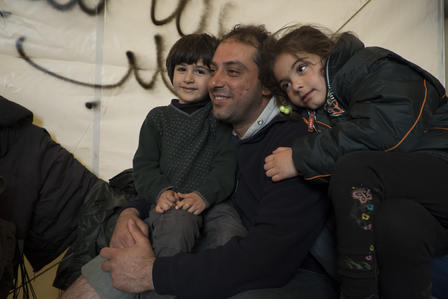 Mohammad Hamadeh with his two children, Mustafa, 4 and Yara, 6, in a tent in a Greek refugee camp.