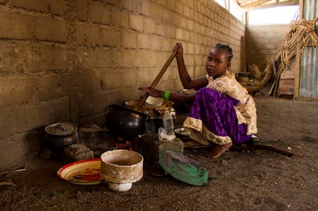Nigerian girl in Cameroon cooks dinner