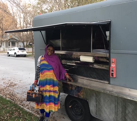 Chef Kaltum of Mother of All stands with Food Truck Chef Kaltum of Mother of All stands with Food Truck