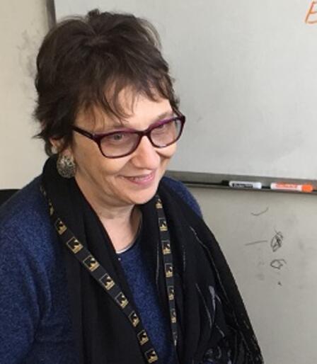 Volunteer, Ginan Volunteer, Ginan, listens to her students during ESL class.