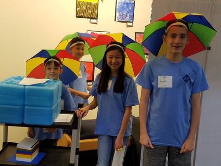 POP Warriors don their umbrella hats before their presentation