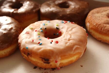 Russian refugee Adolph Levitt invented the first doughnut machine Glazed doughnuts with sprinkles
