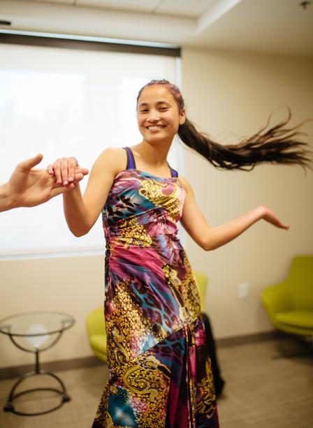 Anita tries on a dress.