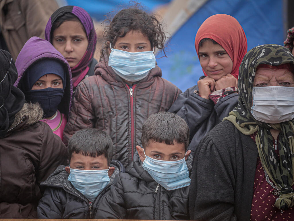 Barn i Syrien med masker