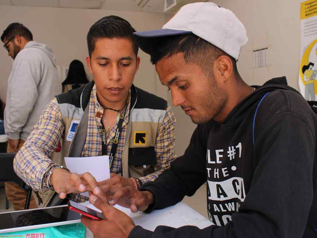 The IRC team providing orientation to asylum seekers in person on how CBP One works the day before Title 42 ends, on May 11th.