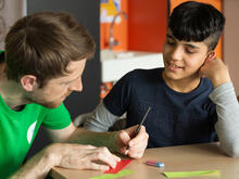 Teacher Jonas and student Homam at the IRC's healing classrooms summer programme in Germany.