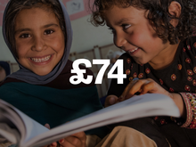 Two children reading a book with the text "£74" overlaid.