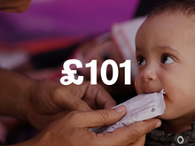 An infant being fed with the text "£101" overlaid.