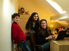 Zahra with her daughter and son in an office in in High Wycombe, Buckinghamshire, Southeast England.