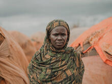 A woman poses for a photo outside in Somalia.