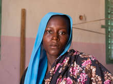 A women poses for a photo in a building in Chad.