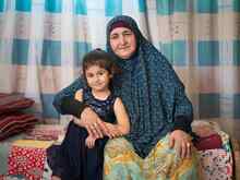  Maria, four years old, spends time in her living room with her grandmother Rahma. Maria’s family fled Syria to Jordan in 2013. Her father, Anas, joined the International Rescue Committee and works for the Reach Up & Learn program. This program teaches parents methods of constructive play to help give their children a head start in school.