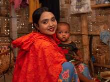A woman and her child pose for a photo in Bangladesh.