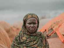 A woman poses for a photo outside in Somalia.