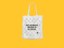 Tote bag with writing "No human being is illegal"