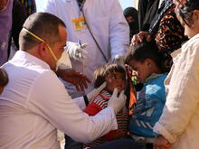Health workers treat displaced children in northeastern Syria