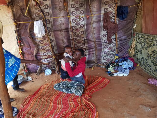 Beeso's husband Abdullahi plays with his six-month-old daughter Hibo