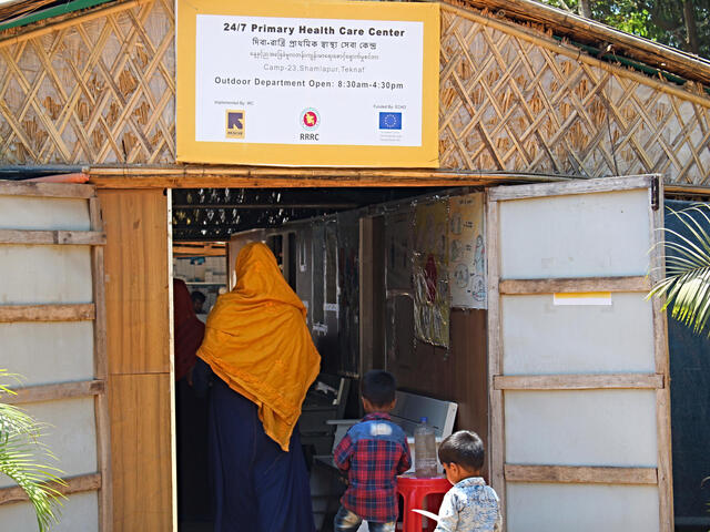 Sakera Akter, 22, visits the IRC's primary health care centre in Cox's Bazar with her two sons after starting to experience flu-like symptoms.