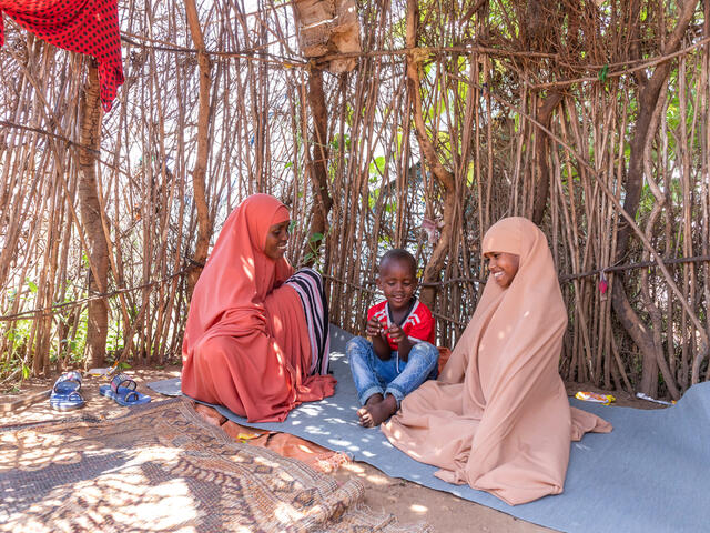 Misra in her temporary home, laughing with her children