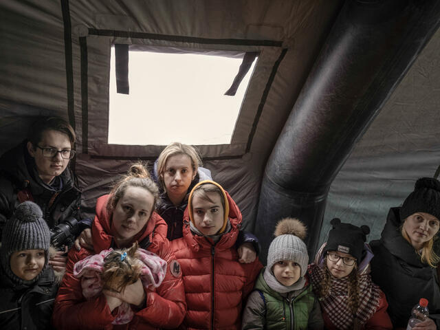 Ukrainian refugees gather at Medyka border crossing point, Poland