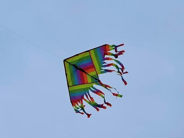A colorful kite suspended in air.