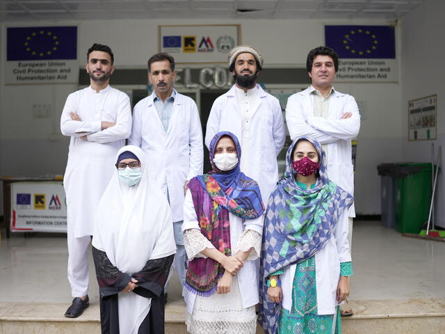 A group of IRC healthworkers pose outside the EU-funded health facility