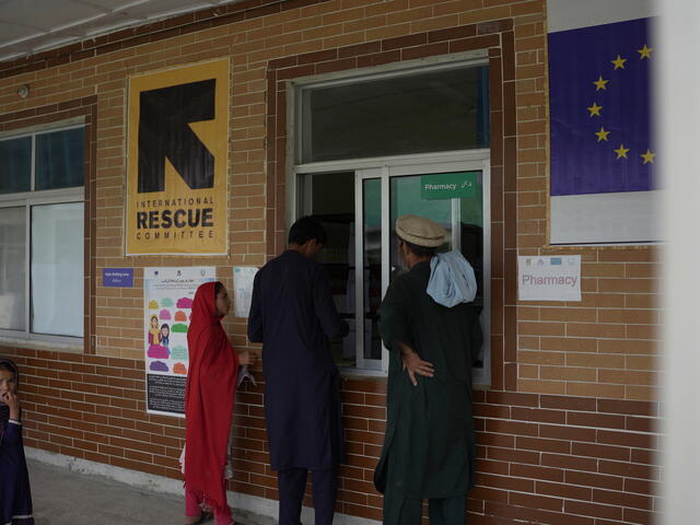 Patients wait for medicines to be dispensed outside a pharmacy located in the IRC's EU-funded health facility in Pakistan