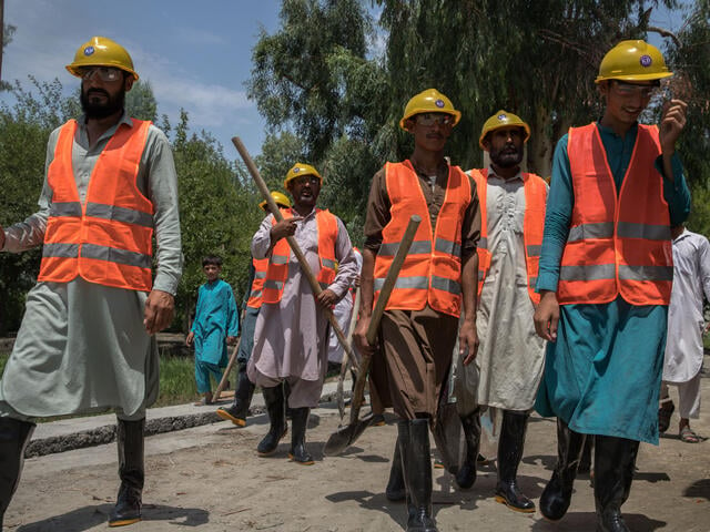 A group of Afghan men on their way to work as construction workers