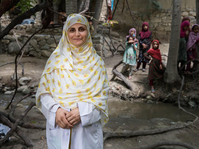 Marwa standing in front of some children