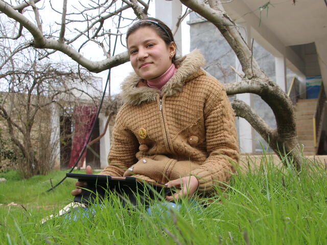 Girl sitting on grass