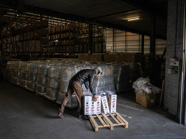 A supply warehouse with an IRC worker