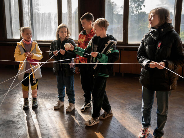 Children playing a game at an IRC children's centre in Ukraine