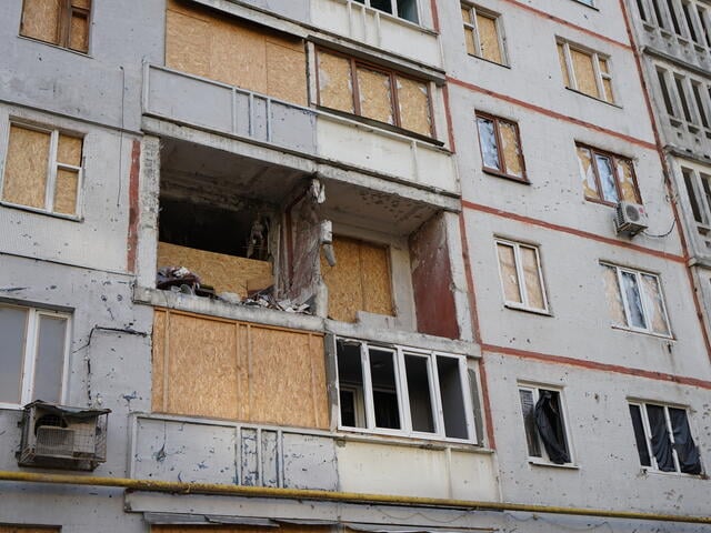 Windows of a residential building in Kharkiv heavily damaged by bombing.