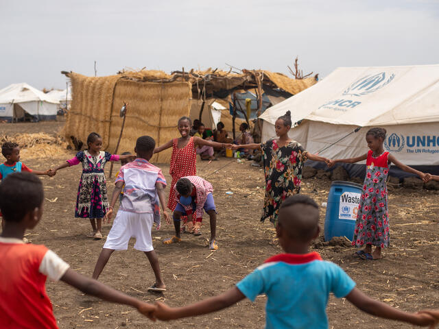 Children play together at Tunaydbah camp, Sudan.