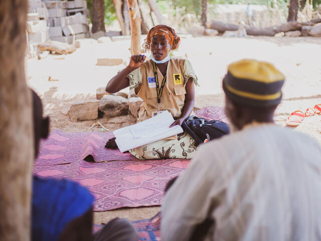 Zara talks to families, especially fathers, about the benefits education could have in the life of a child.