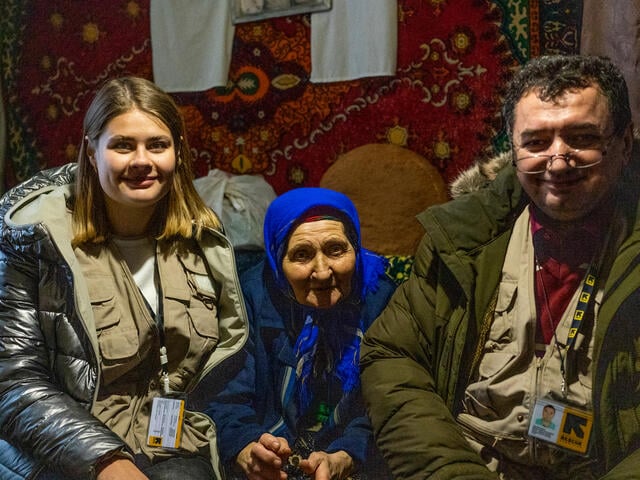 Dr. Oleg and community mobilizer Darina Holub pose with patient Lidia.  