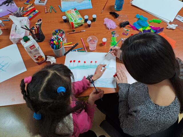 One of Karima's children drawing in an independent living facility