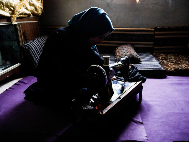 Watfa using her sewing machine