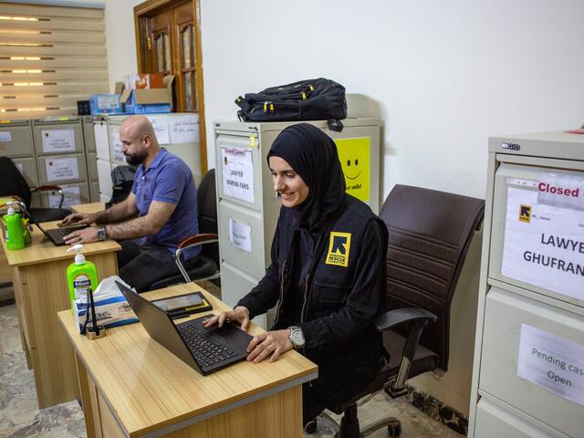 Marwa, a lawyer in IRC Iraq's Protection and Rule of Law (PRoL) team, sits with colleagues in the IRC office in Ramadi, where the atmosphere is one of mutual support. 